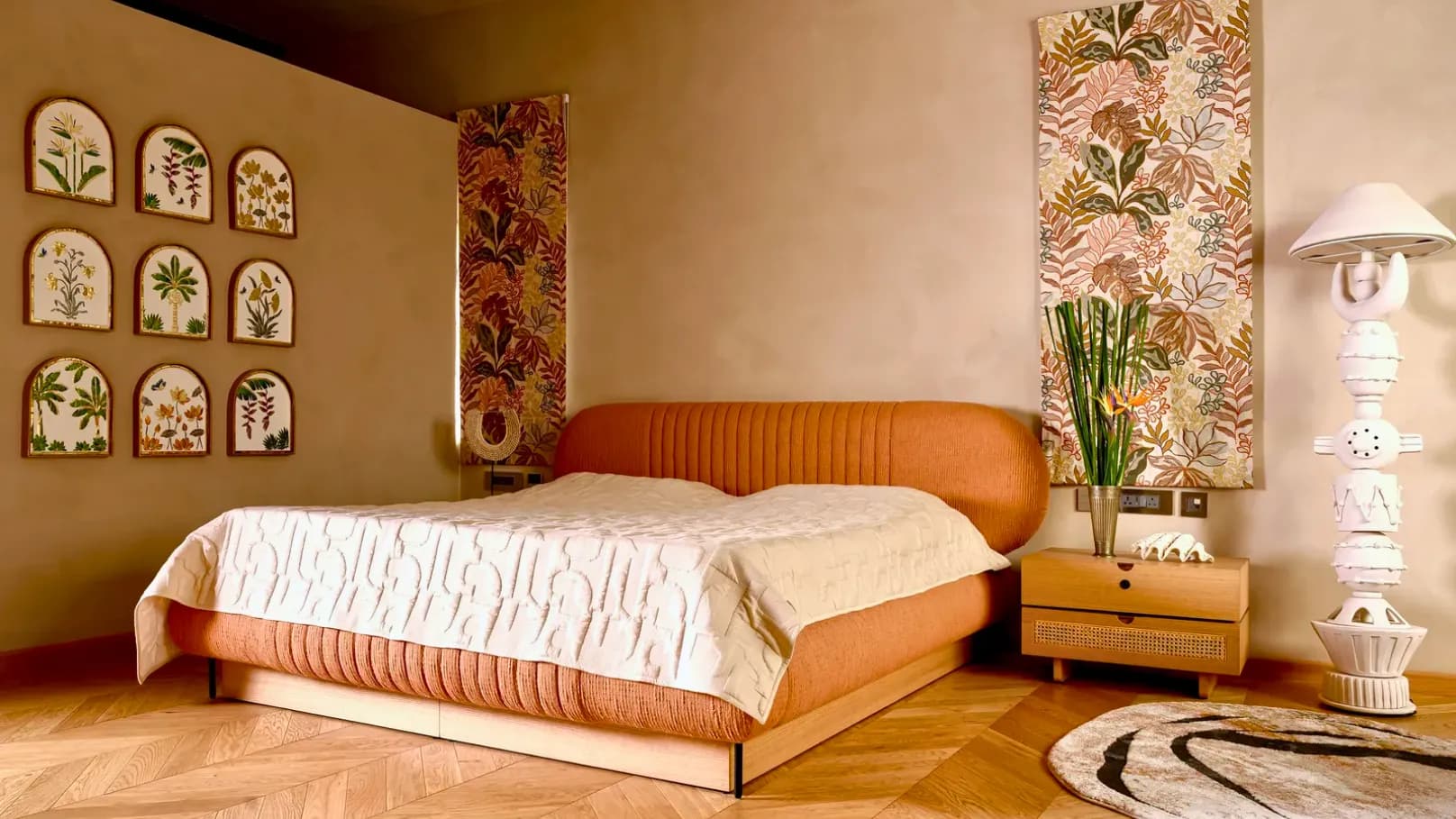 Soft-toned RAVYA bedroom interior with a panelled headboard wall.