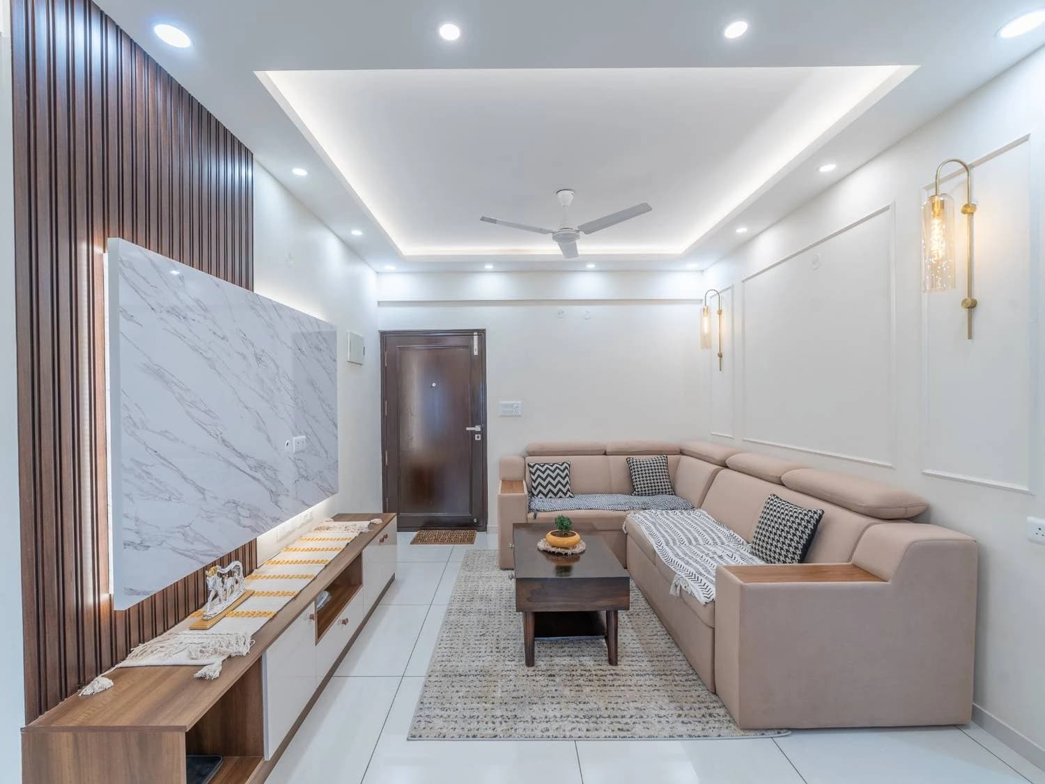Detailed RAVYA ceiling finish with layered profiles and downlights.