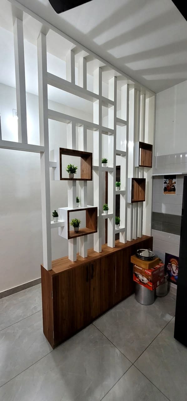 Tall RAVYA display and storage unit in a living room, built in PVC.