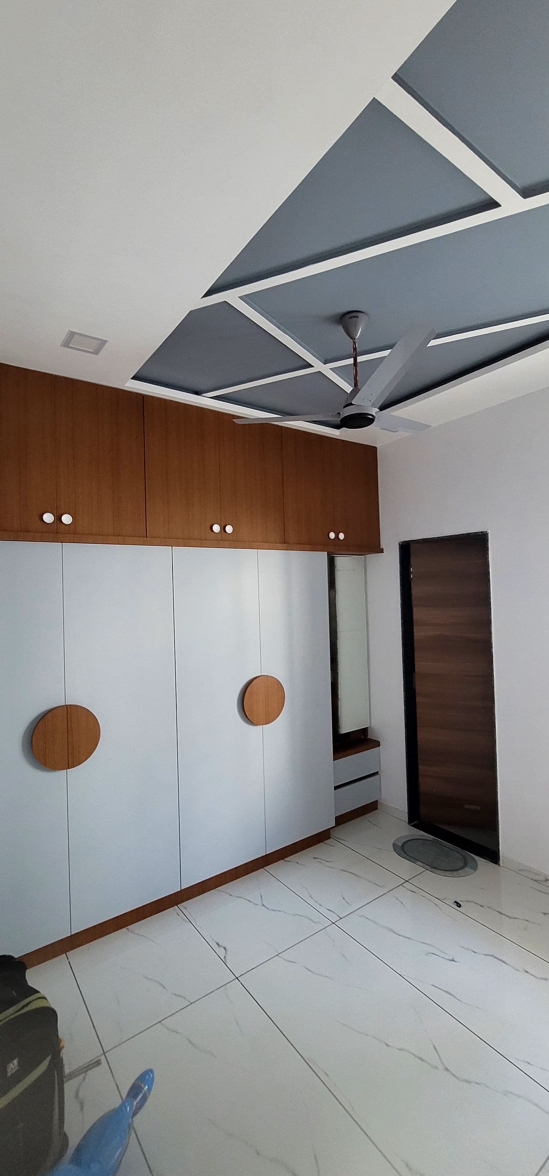 Contemporary RAVYA wardrobe finish with hinged shutters.