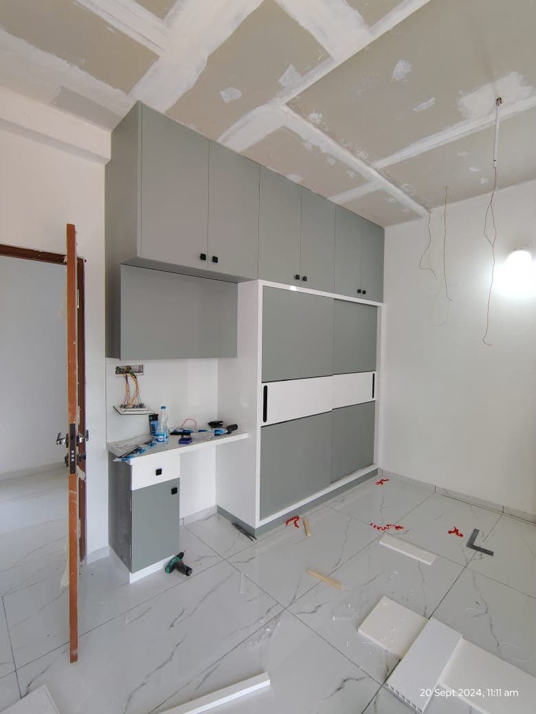 Organised RAVYA wardrobe interior with shelving and drawers.