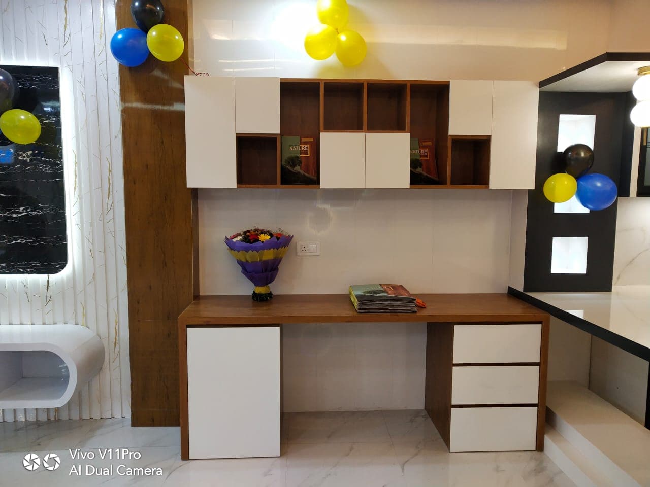 Showroom study desk with wall-mounted storage cubbies.
