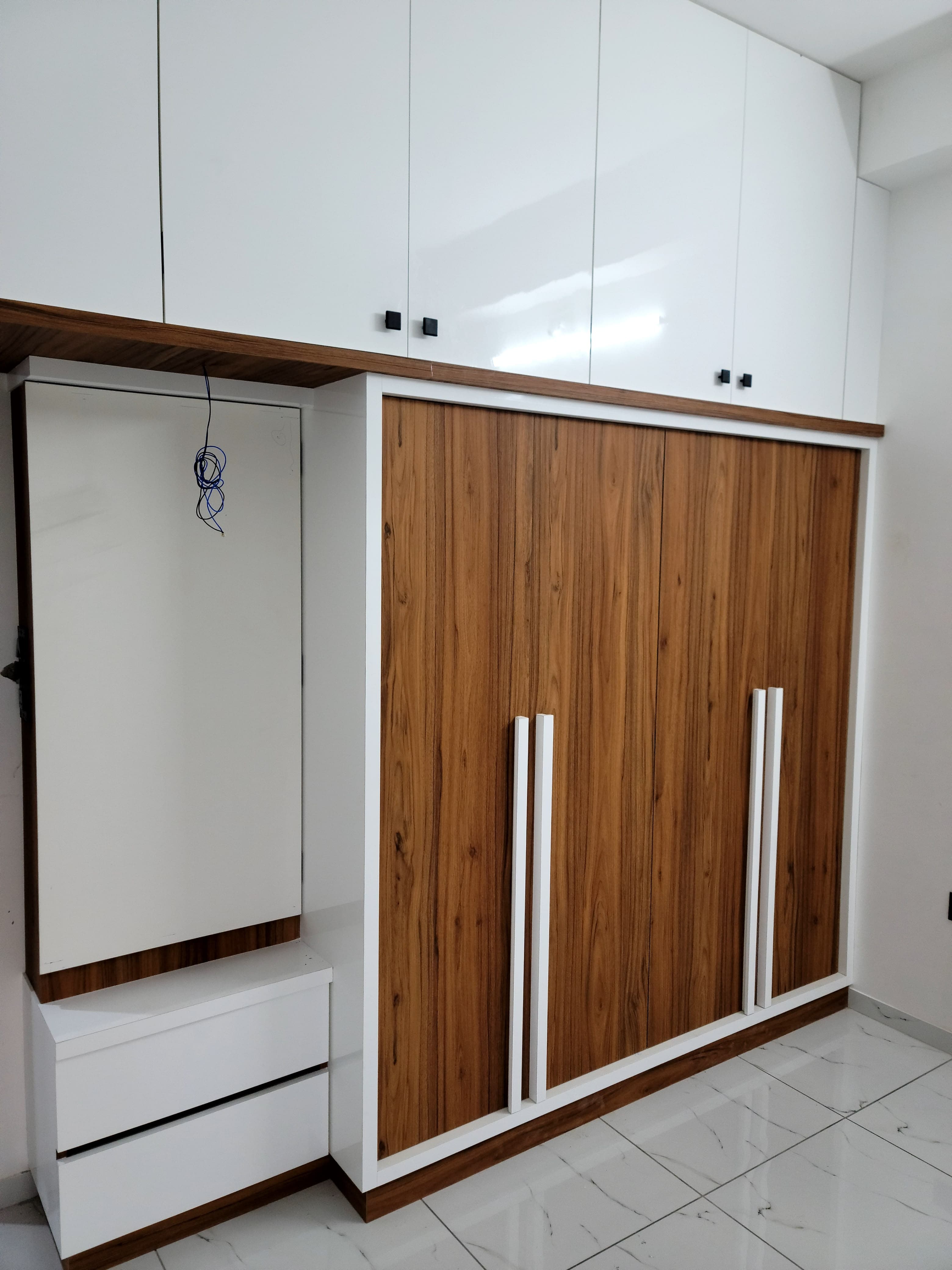 A RAVYA bedroom wardrobe in situ with fitted internal storage.
